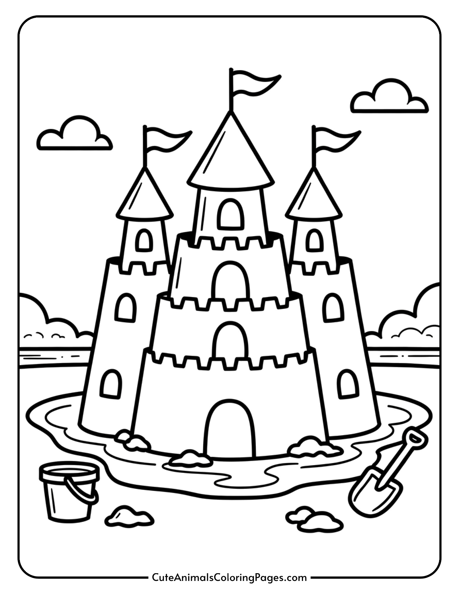 A detailed sandcastle with multiple towers, decorative flags, a surrounding moat, and a bucket and shovel.