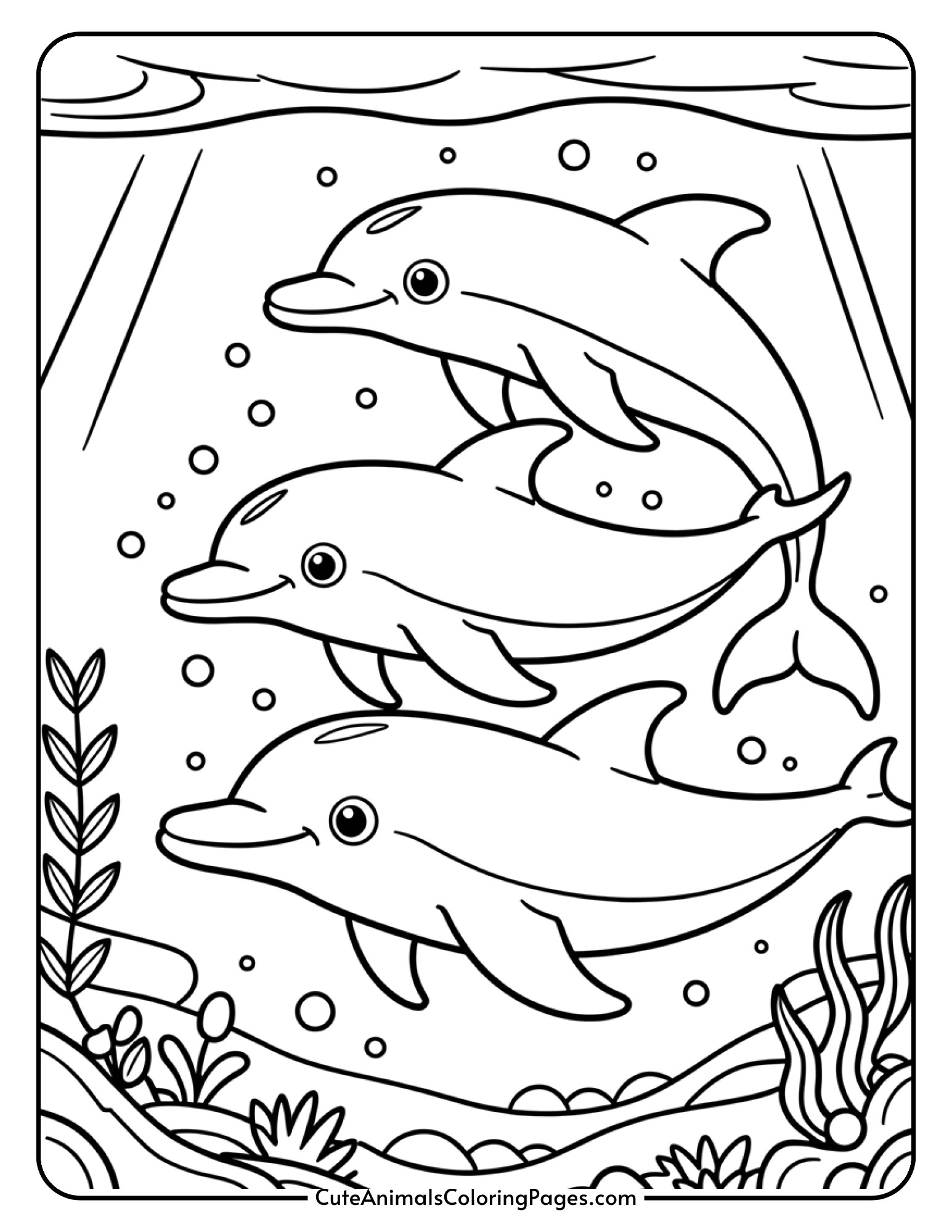 Three dolphins of different sizes swimming together as a family group with bubbles around them.